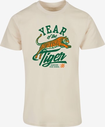 ABSOLUTE CULT T-Shirt 'Stranger Things - Hawkins Year of The Tiger 86' in Beige: Vorderseite