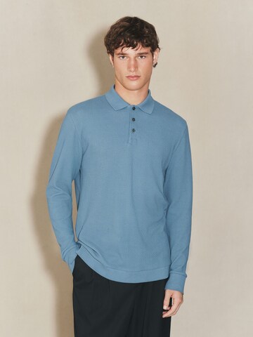 Next T-shirt i blå: framsida