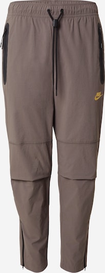 Kelnės iš Nike Sportswear, spalva – rausvai pilka, Prekių apžvalga