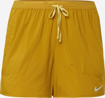 NIKE Regular Sports trousers 'STRIDE' in Yellow: front