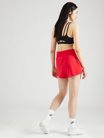 Nike Sportswear Loose fit Trousers 'Phoenix Fleece' in Red