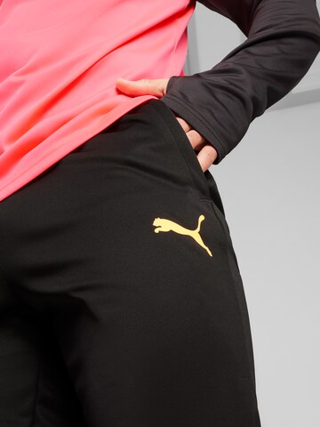 Effilé Pantalon de sport 'TeamLIGA' PUMA en noir
