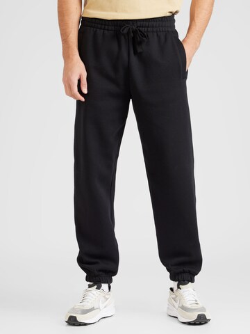 TOPMAN - Tapered Calças em preto: frente