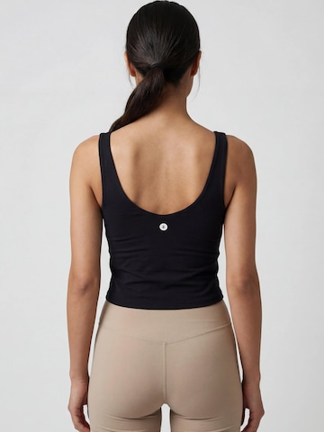 Nomi Active Sporttop in Schwarz
