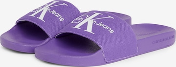 Calvin Klein Jeans Mules in Purple