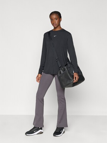 NIKE Расклешенный Спортивные штаны 'ONE' в Серый