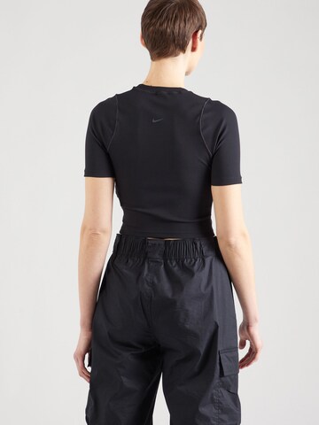 NIKE - Camiseta funcional en negro