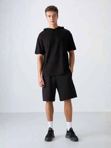 T-Shirt Tommy Life en noir : devant