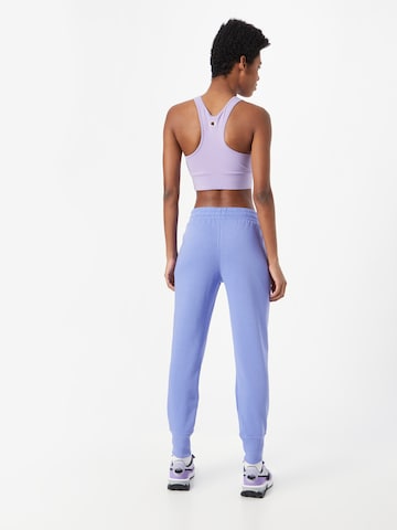 Effilé Pantalon de sport 'Rival' UNDER ARMOUR en bleu