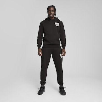 PUMA Sportsweatshirt 'Posterize' in Zwart: voorkant