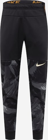 NIKE Tapered Workout Pants in Black: front