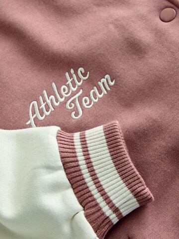 Next Tussenjas in Bruin