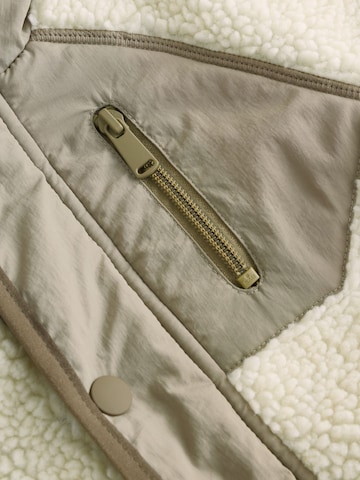 Next Tussenjas in Beige
