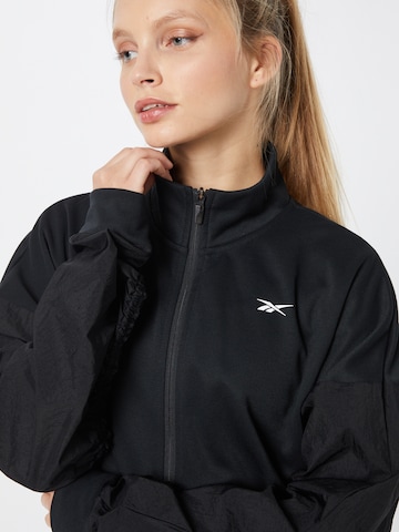 Reebok Sportsweatjacke in Schwarz