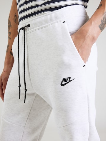 Nike Sportswear Tapered Παντελόνι 'TCH FLC' σε λευκό