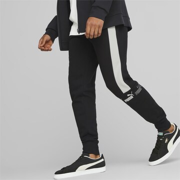 PUMA Tapered Sportbroek in Zwart: voorkant