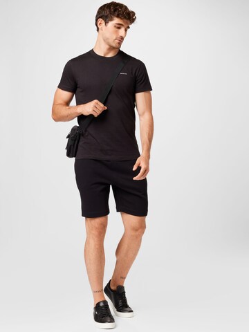 regular Pantaloni di LACOSTE in nero