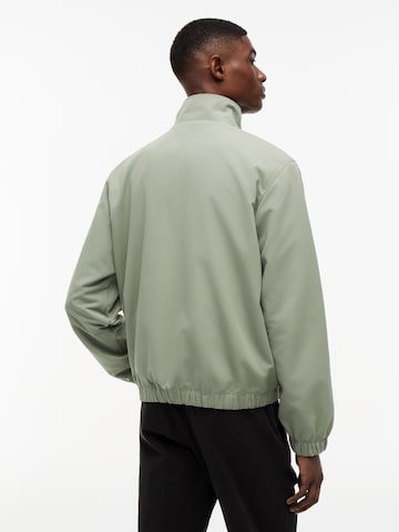 Tommy Jeans Tussenjas 'ESSENTIAL' in Groen