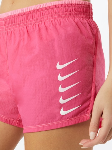 NIKE Regularen Športne hlače | roza barva