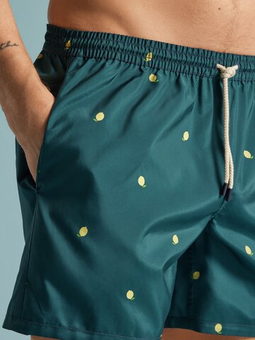 IUMAN Intimissimi Badeshorts with bottle opener in Blau