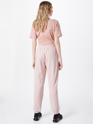 Effilé Pantalon Nike Sportswear en rose