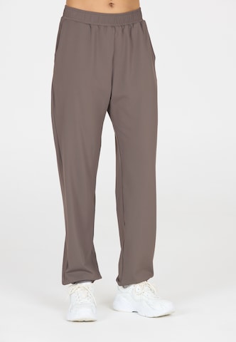 Athlecia Regular Sports trousers in Brown: front
