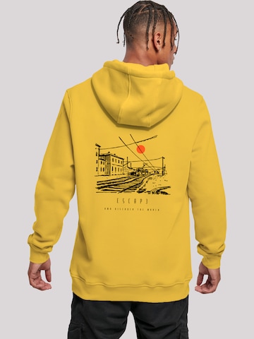 Sweat-shirt 'Escape Discover The World Town Train Station' F4NT4STIC en jaune : devant
