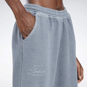 Reebok Slimfit Sportovní kalhoty 'Les Mills®' – modrá