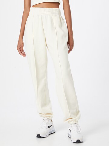 Loosefit Pantaloni di Nike Sportswear in beige: frontale