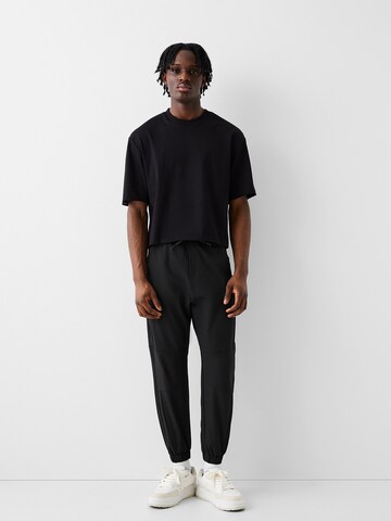 Bershka Tapered Pants in Black