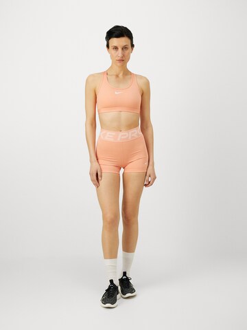 NIKE Skinny Sportshorts in Orange