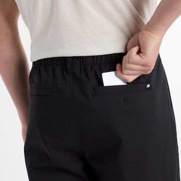 Loosefit Pantalon à pince 'Athletics' new balance en noir