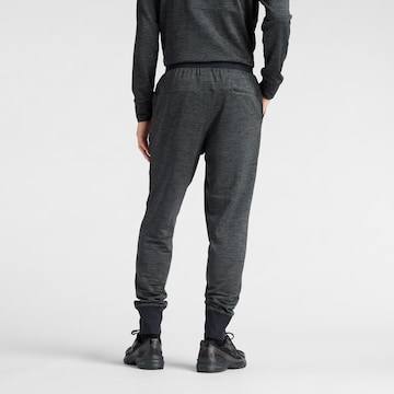 Effilé Pantalon de sport 'Athletics Heat Grid' new balance en noir