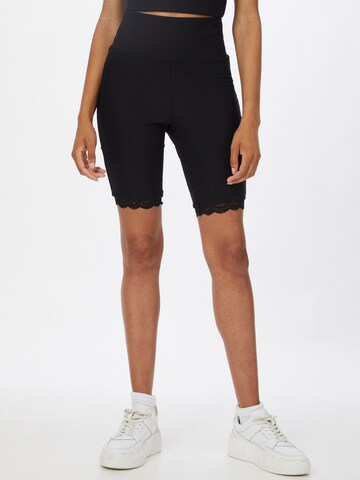 Urban Classics Skinny Leggings in Black: front