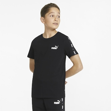 PUMA - Camiseta en negro: frente