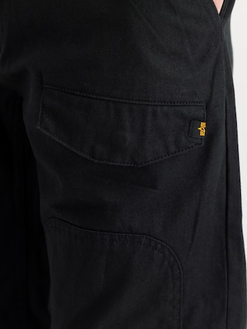 ALPHA INDUSTRIES Loose fit Cargo trousers 'CWU-18/P' in Black: side