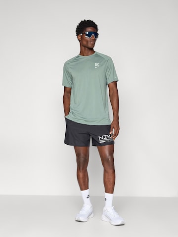 NIKE Szabványos Sportnadrágok 'WNTRZ CHLNGR' - fekete
