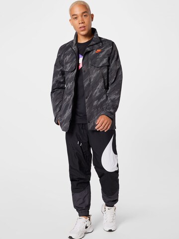 Nike Sportswear - Chaqueta de entretiempo en gris