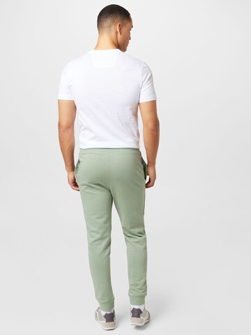 HUGO Zwężany krój Spodnie 'Dutschi' w kolorze zielony