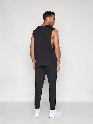NIKE Tapered Sportsbukser 'PRMRY' i sort