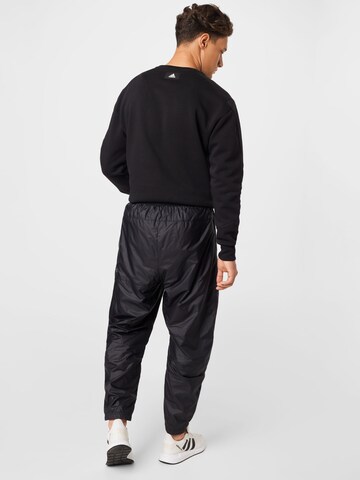 ADIDAS SPORTSWEAR Tapered Urheiluhousut värissä musta