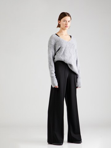 Guido Maria Kretschmer Women Wide leg Trousers with creases 'Dana' in Black