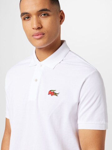T-Shirt 'Netflix' LACOSTE en blanc