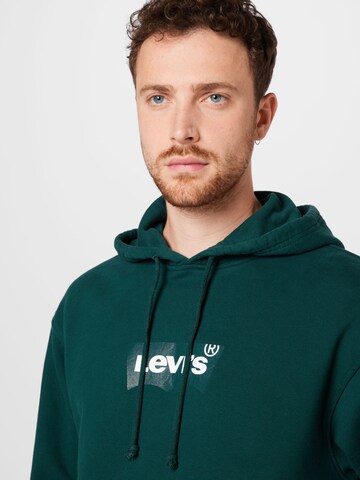 LEVI'S ® Средняя посадка Свитшот 'Relaxed Graphic Hoodie' в Зеленый