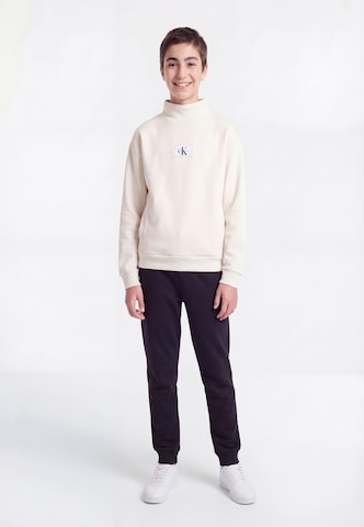 Calvin Klein Jeans Mikina – béžová: přední strana