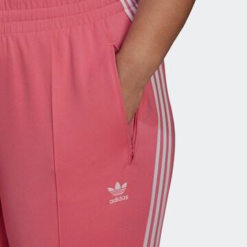 ADIDAS ORIGINALS Slimfit Housut värissä vaaleanpunainen