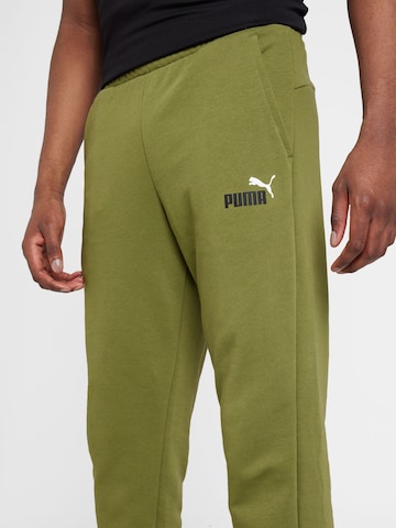 PUMA Tapered Sports trousers 'ESS+' in Green