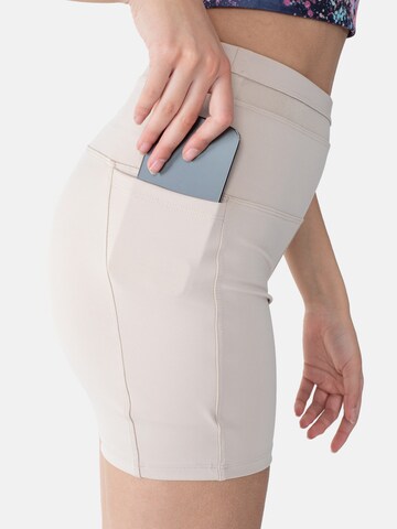 Skinny Pantaloni sportivi di Spyder in beige