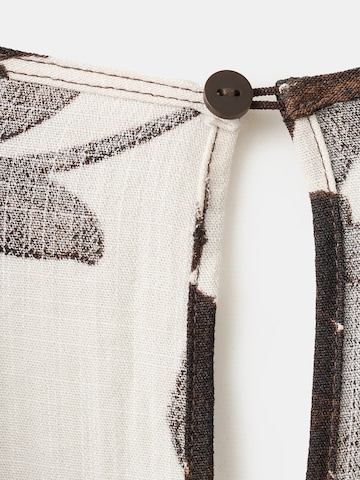 Salopeta 'Simba' de la MANGO pe bej