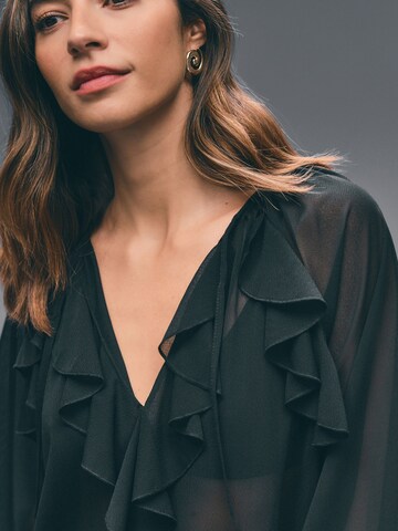 Next - Blusa en negro